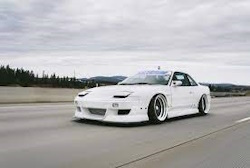 white 240sx on road with sleepy headlights white 240sx on road with sleepy headlights